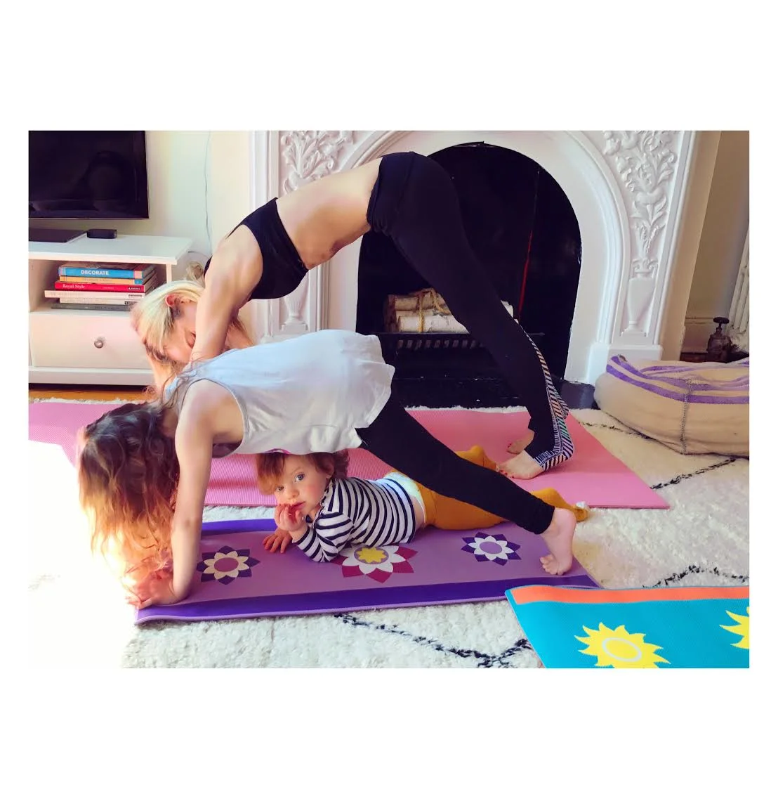 Ph: Downward dog with the family. Spot the slacker! Photographed by James Dimmock