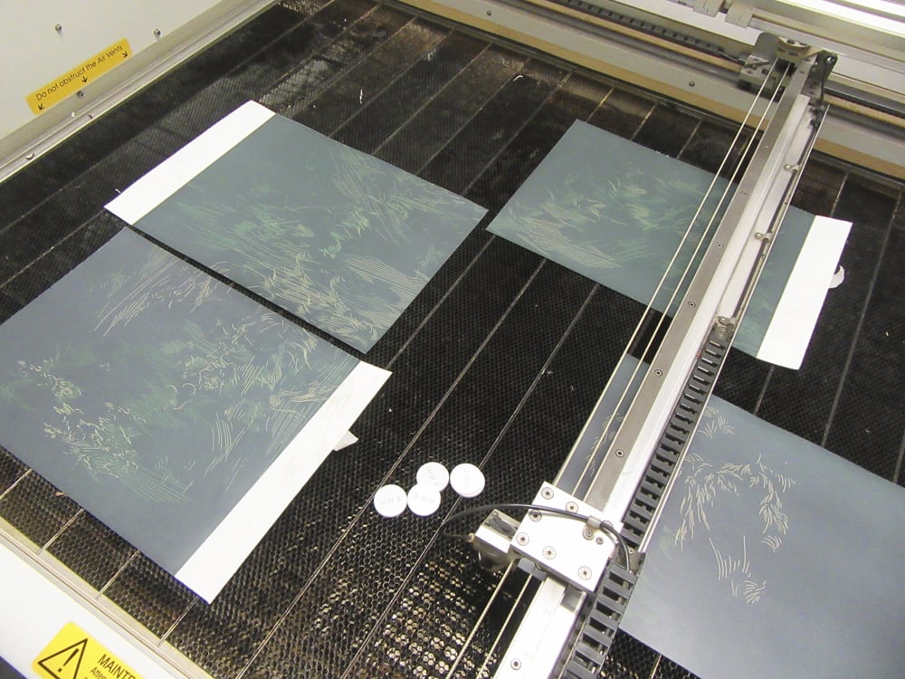 Working multiple laser engraved prints at a time. Dundee Contemporary Arts, Dundee, Scotland, 2015.