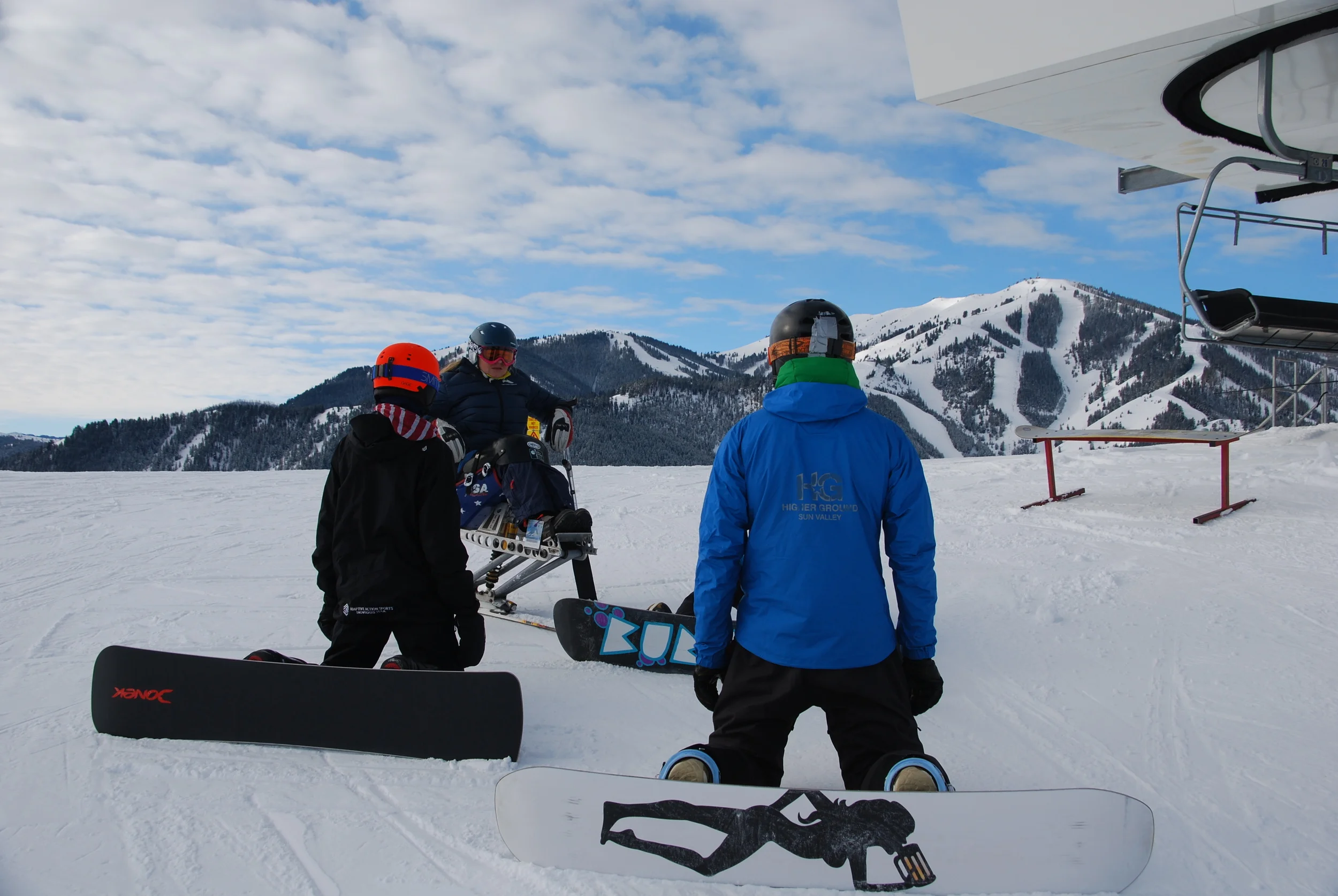 Zach Miller (bright orange helmet) US Paralympic snowboard team hopeful. Tim Ball (Blue HG coat) instructor to Zach, Alaina ONeill not shown but her board is, and myself.