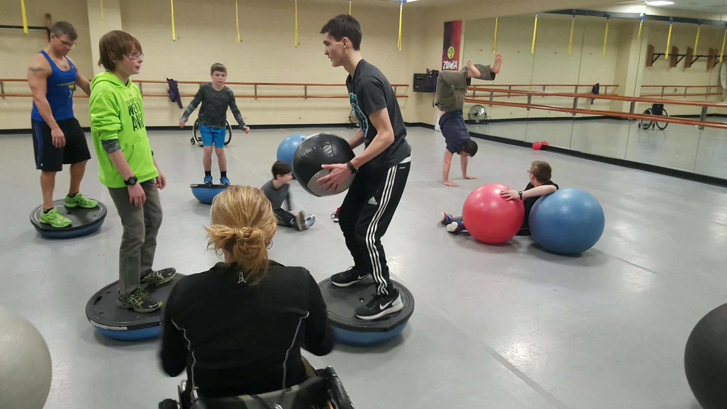 Doing some balance training in the gym with medicine and bosu balls.
