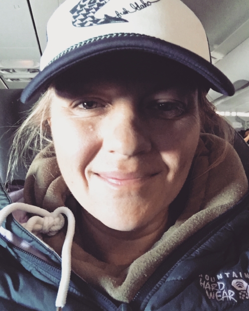 Sitting on the plane.