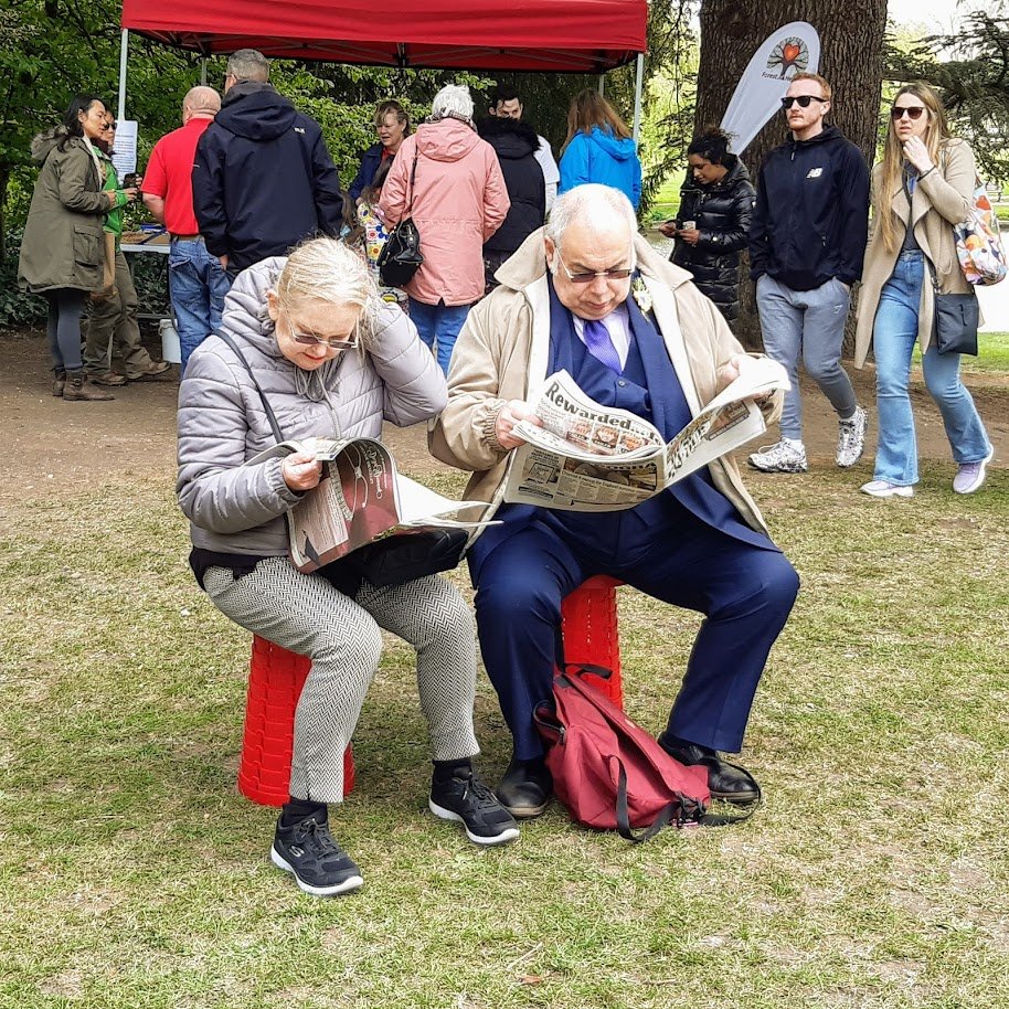 elderly couple reading newspaper.jpg