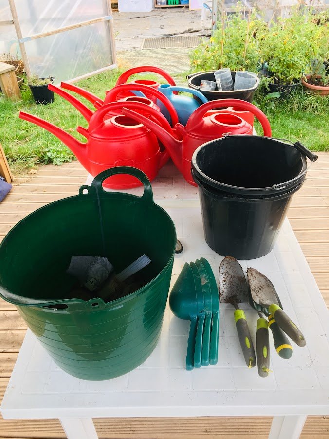 Gardening tools and watering cans.JPG