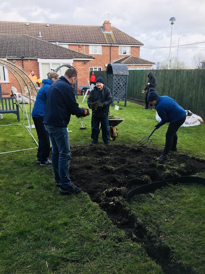 volunteers digging a border in Heathcote Garden.JPG