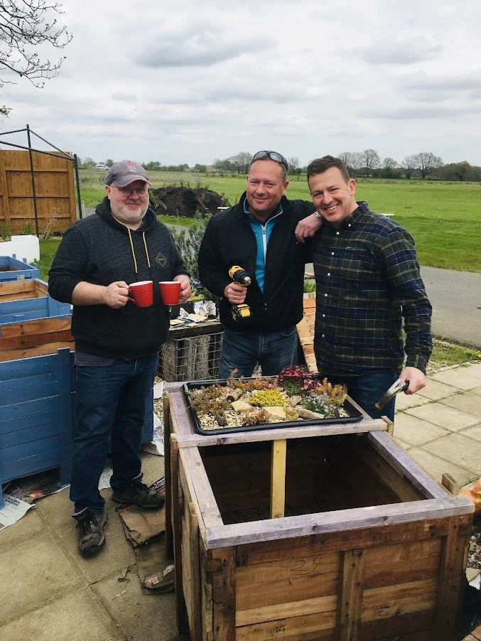 national grid employees creating apline bed planter.JPG