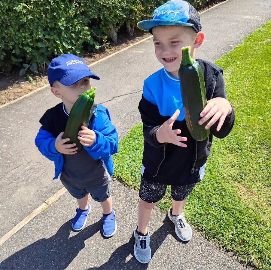 children pleased with their courgettes.jpg