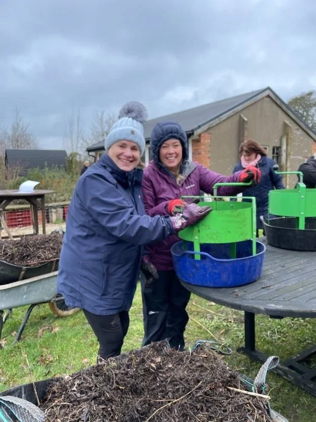 volunteers sieving compost.jpg