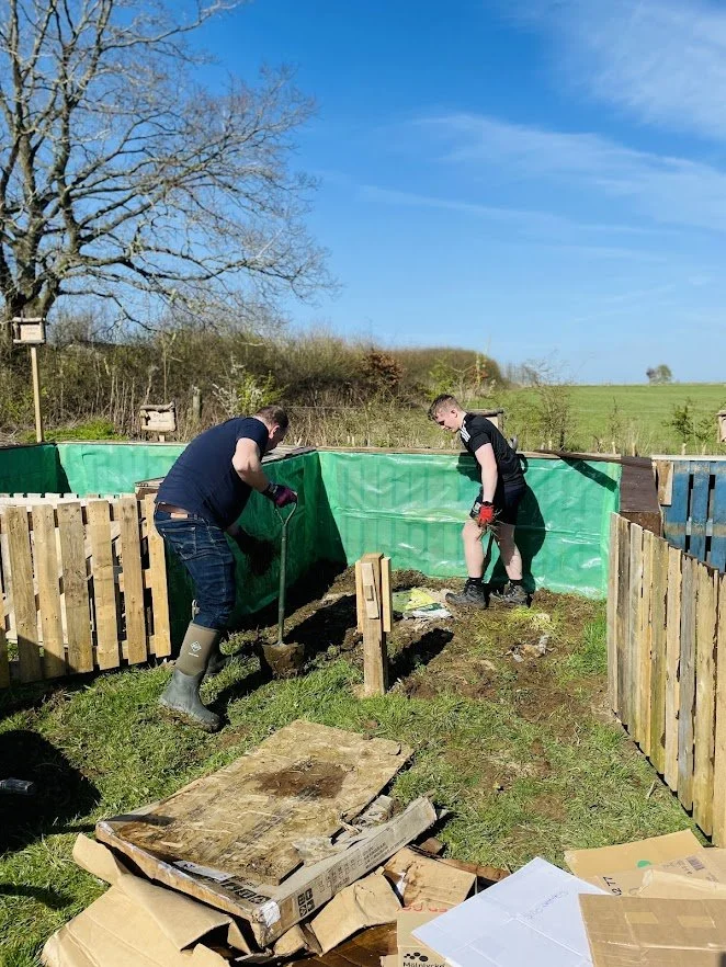 volunteers creating composter.jpg