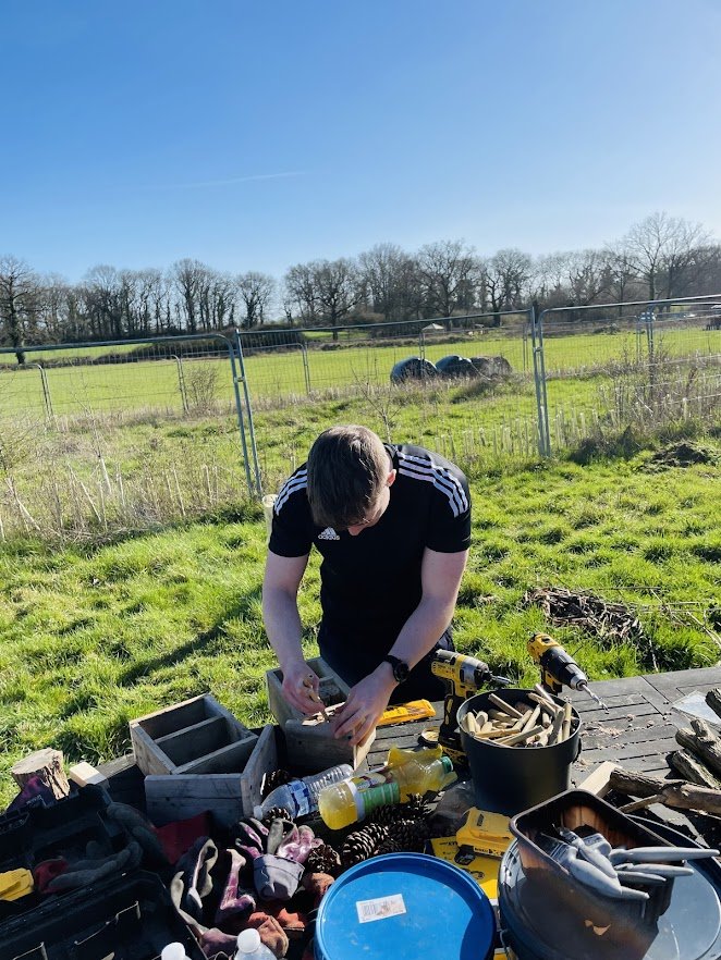 corporate volunteer creating bug hotel.jpg