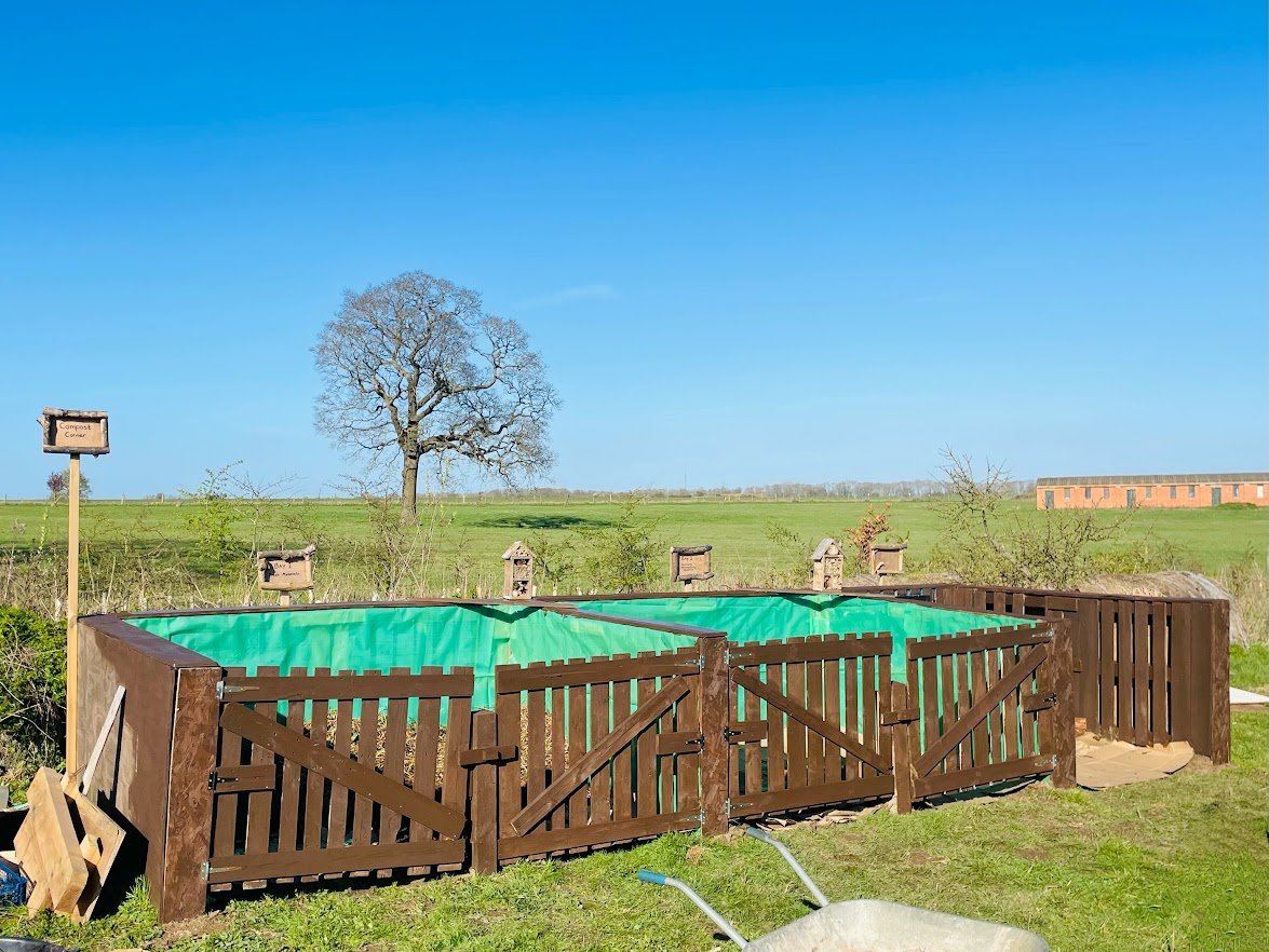 Compost bay created from scrap wood.JPG
