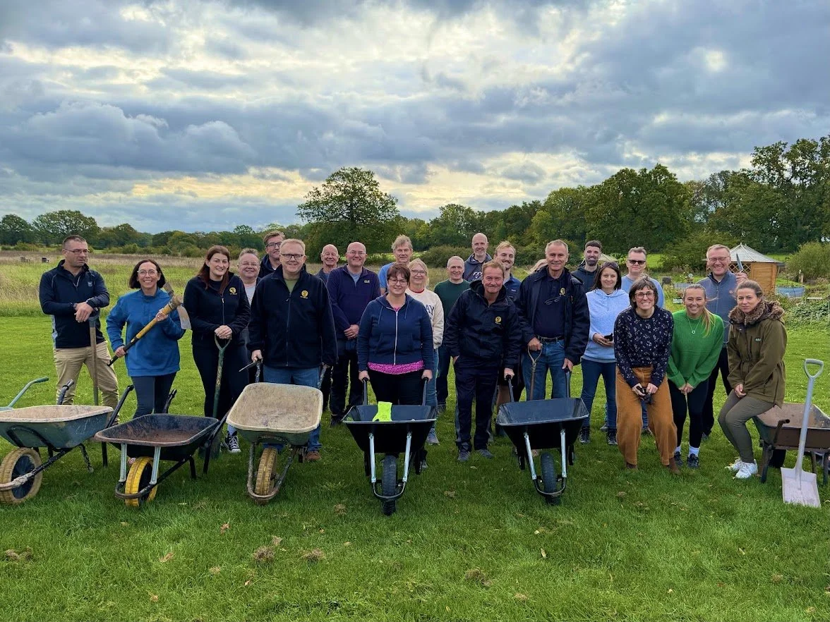 NFU Mutual volunteers working together at the Garden of Arden in Stratford‑upon‑Avon, painting, gardening and improving outdoor spaces as part of Forest of Hearts’ charitable wellbeing projects under NFU Mutual’s Doing Our Bit initiative.