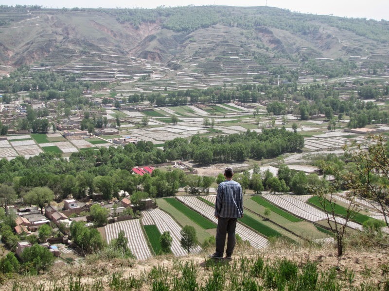 Jodie's husband looking over the village.