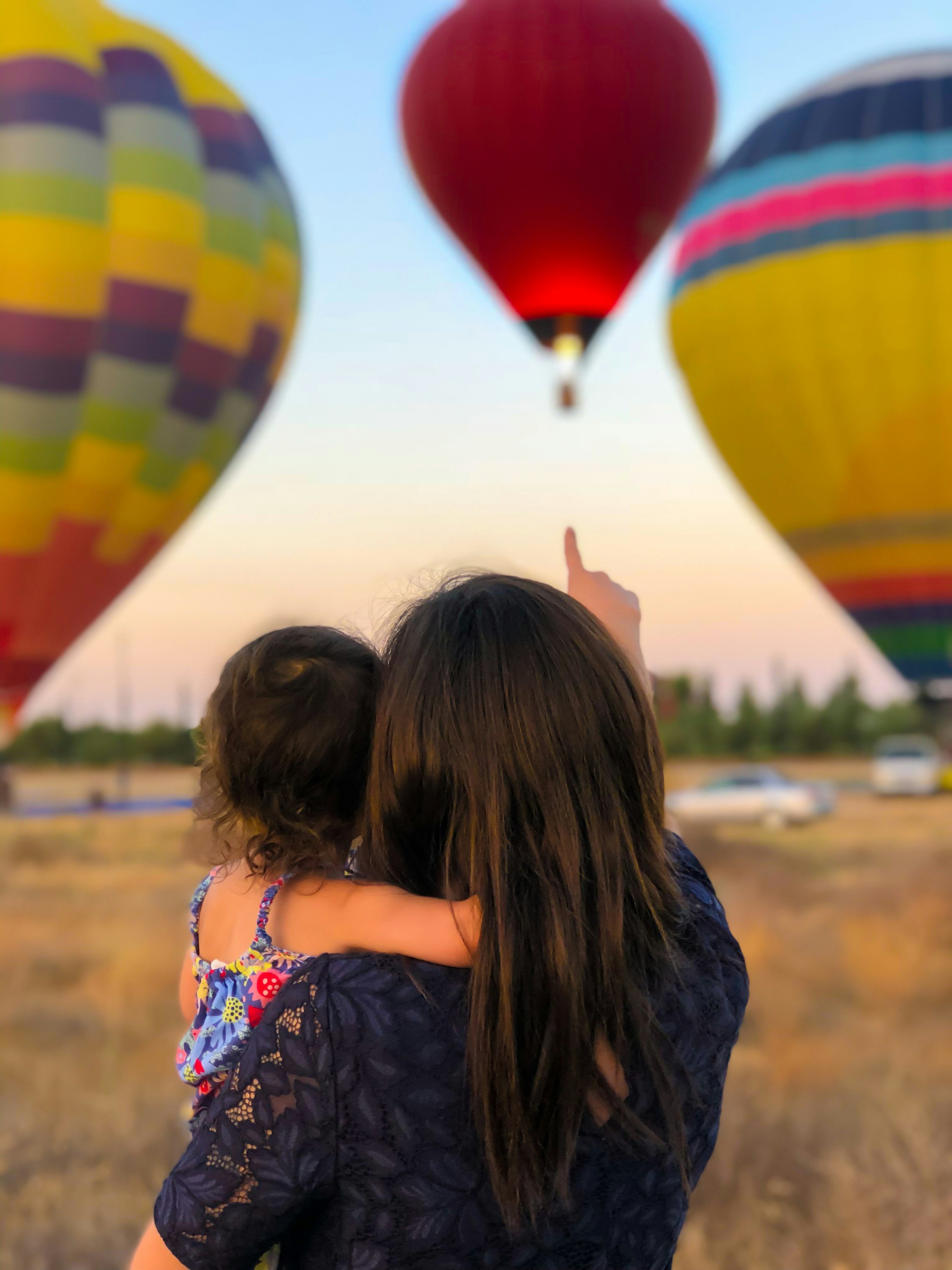 Woman and child looking at hot air balloon