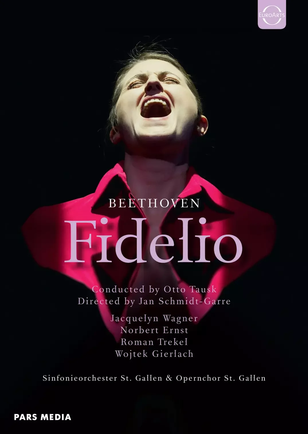 Poster for Beethoven's Fidelio opera featuring a woman with blonde hair, open mouth, and closed eyes, wearing a red shirt. The poster includes the title 'Fidelio', conductor Otto Tausk, director Jan Schmidt-Garre, and the names of performers Jacquelyn Wagner, Norbert Ernst, Roman Tekel, and Wojtek Gierlach, with orchestras Sinfonieorchester St. Gallen and Openorchestra St. Gallen.