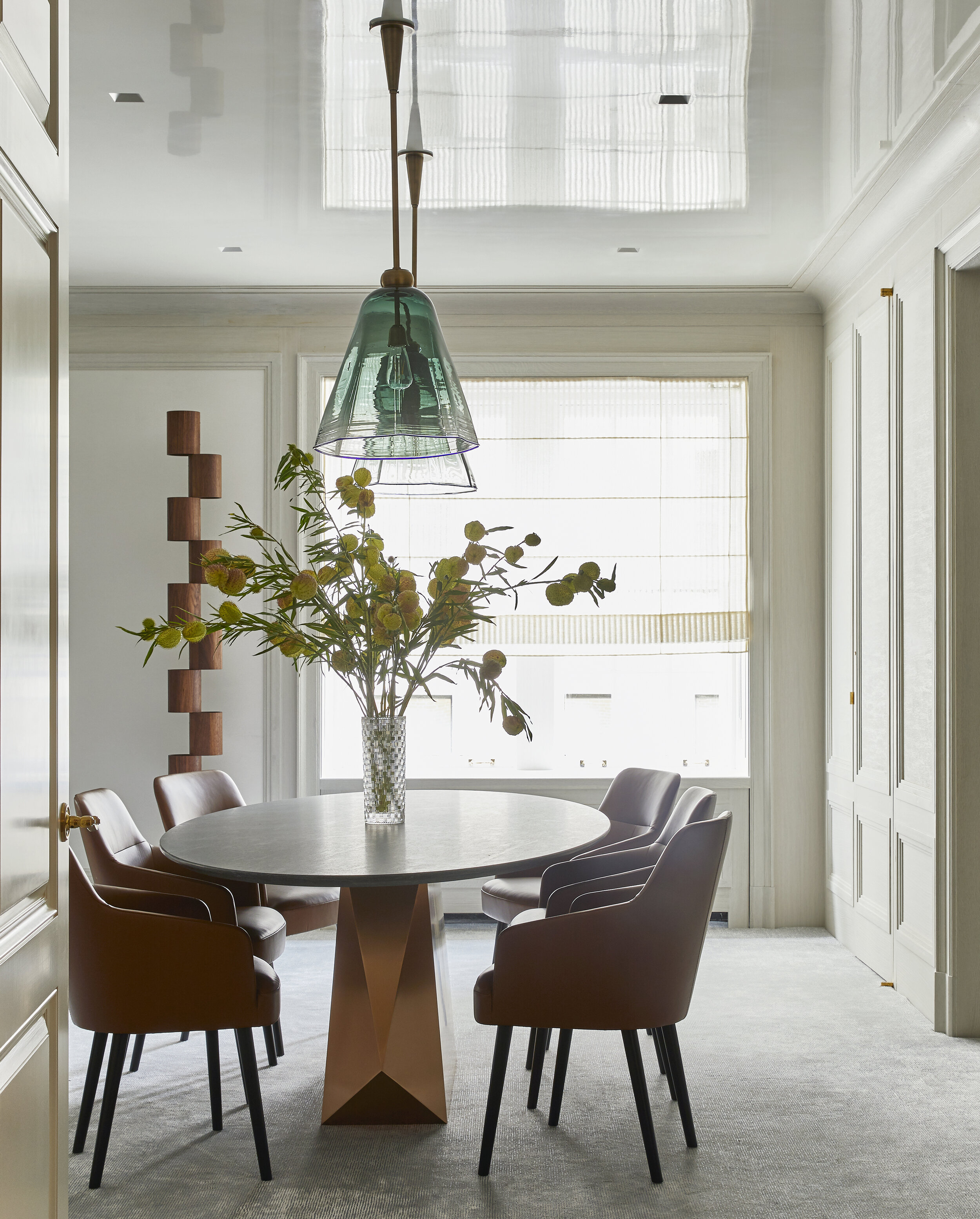Custom hand-tufted carpet by Crosby Street Studios Murano Blown Glass Faceted Lanterns from L’Art de Vivre Henry Dining Table from Egg Collective Mono dining chairs from Avenue Road