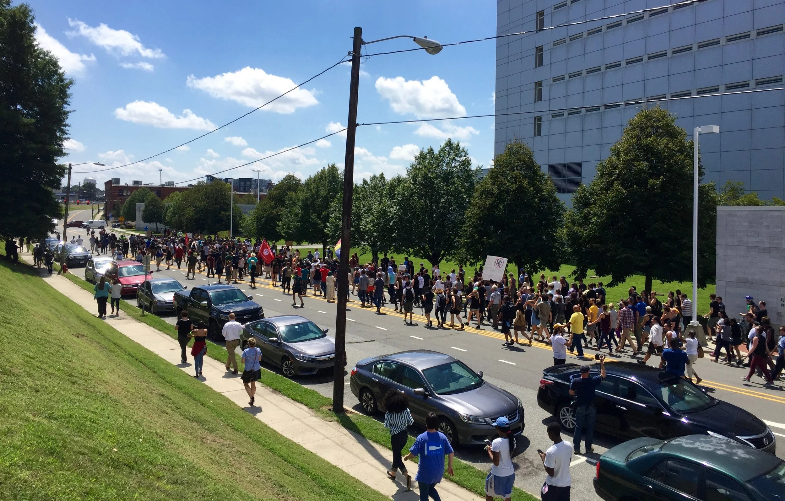 Counterprotestors march in anticipation of a KKK rally on Friday, August 18, 2017. This shot is overlooking Pettigrew Street, in front of the jail. Photo by Kyle Sherard.