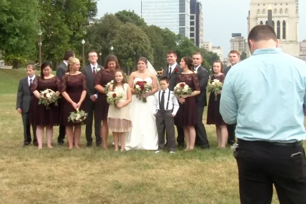 The Media Buff (in blue) filming the wedding party.