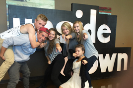 Students in front of the sign.