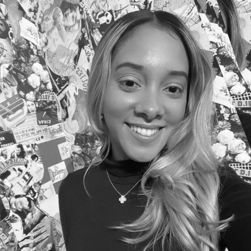 A woman with long blonde hair smiling in front of a collage of various images and posters.