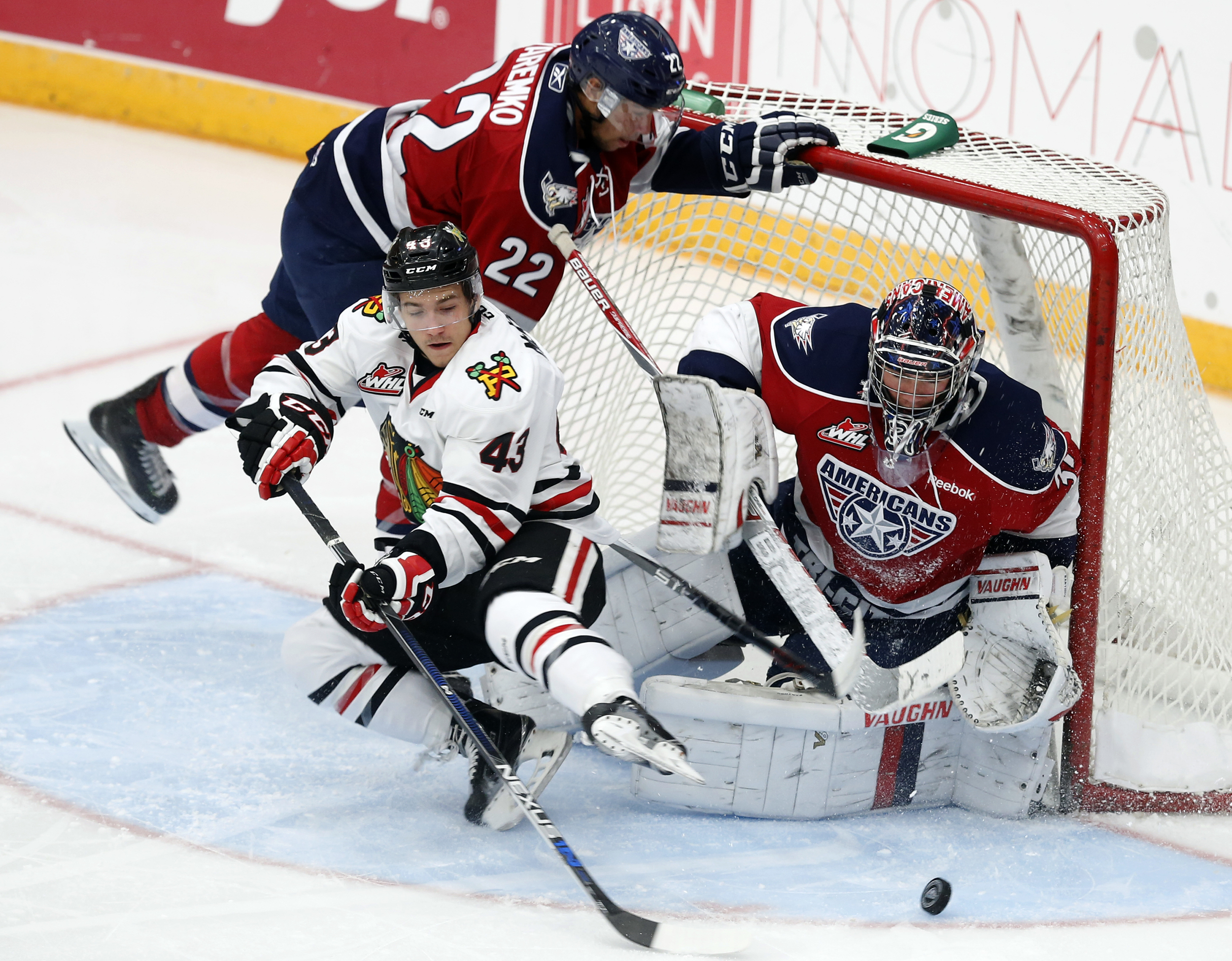  Tri City Americans' Ervan Sarthou (31) and Nolan Yaremko (22) block a goal attempt from Portland Winterhawks' Skyler McKenzie (43) October 24, 2015 during a game at the Toyota Center in Kennewick. (Tri-City Herald)  