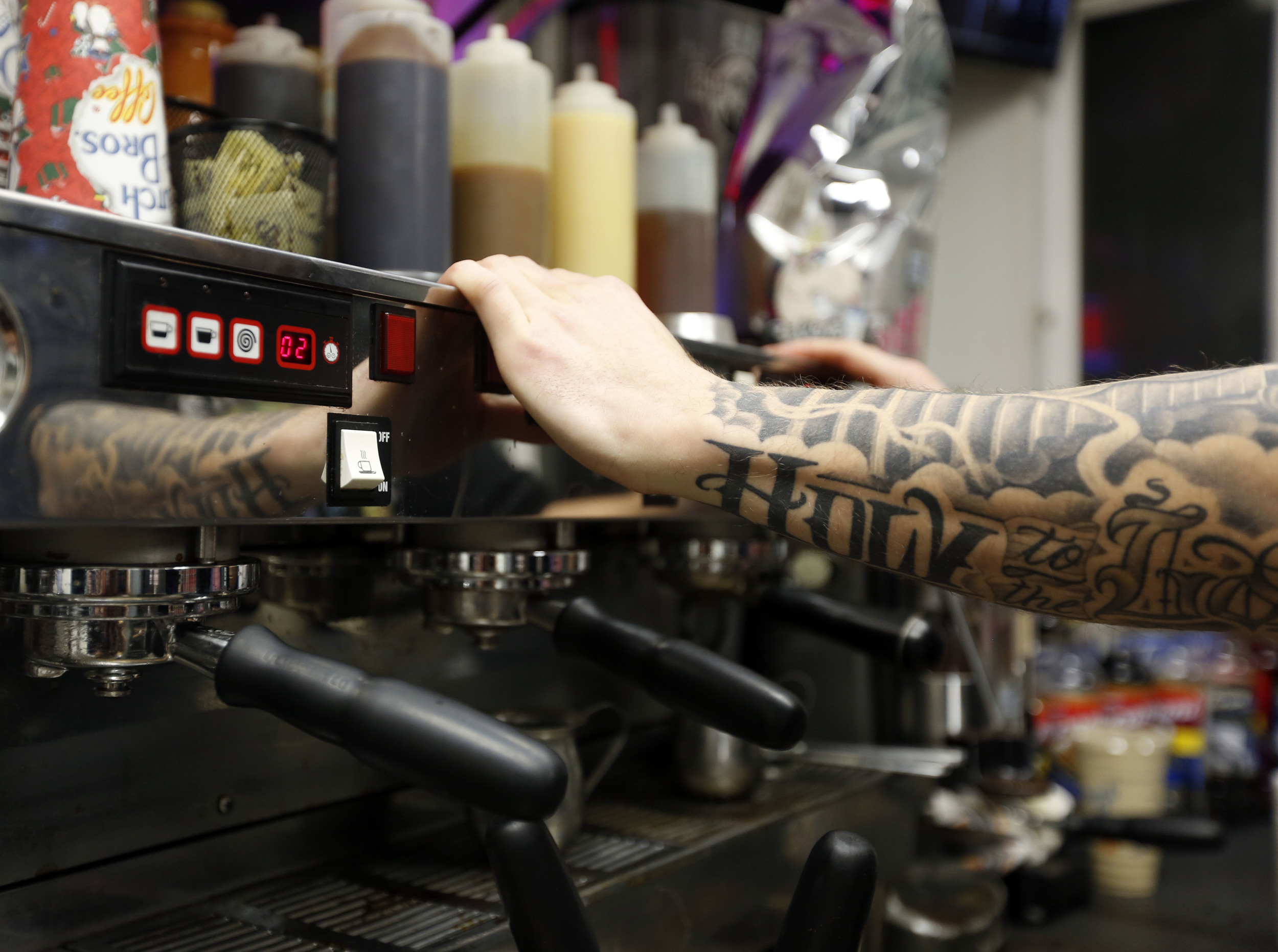   Zade Hakki cleans the espresso machine while working at 12 a.m. on the graveyard shift at Dutch Bros. Coffee on Clearwater Avenue in Kennewick. For Hakki the job isn’t about making coffee but the conversations with customers.     