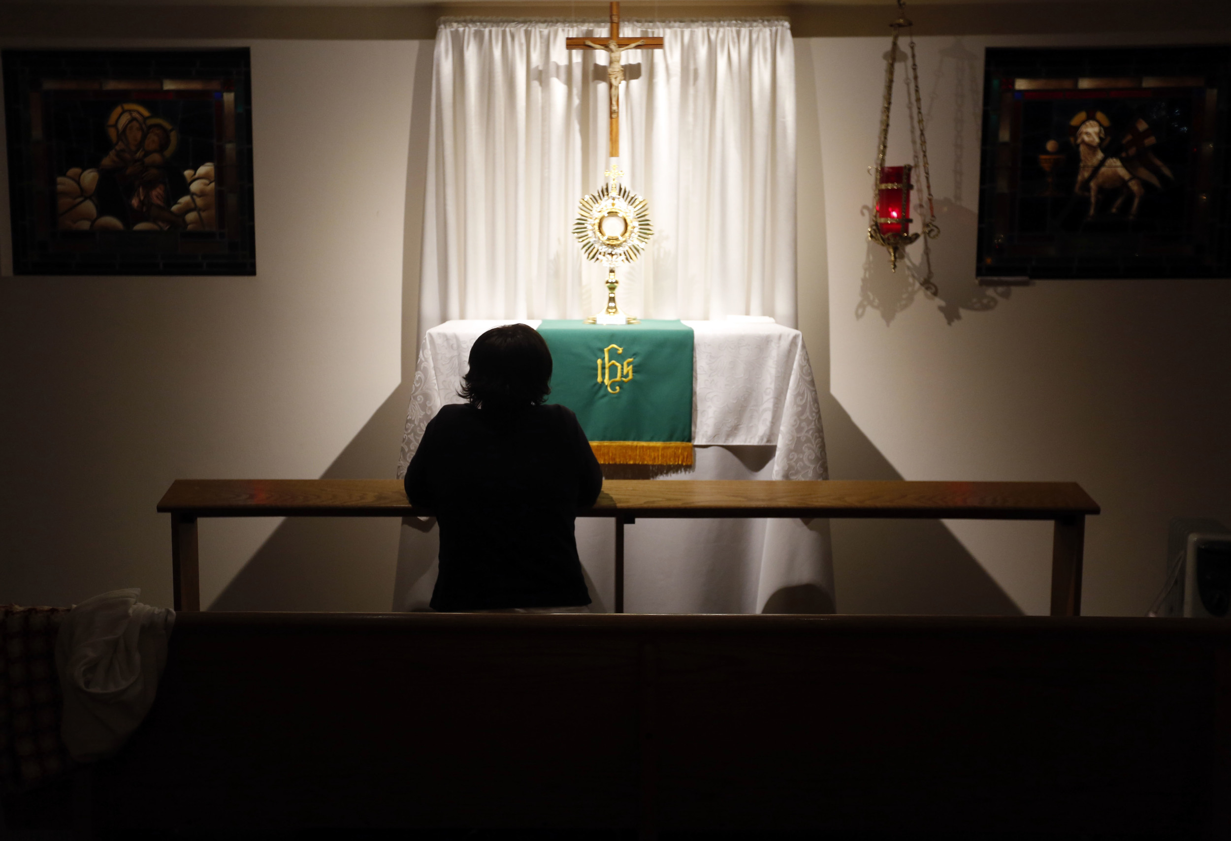   Carol LeCompte, 66, of Kennewick, sits quietly as she prays at the perpetual adoration chapel at St. Joseph Catholic Church in Kennewick during the 2 a.m. hour. LeCompte, who is the coordinator of the program, spends a few early morning hours a wee