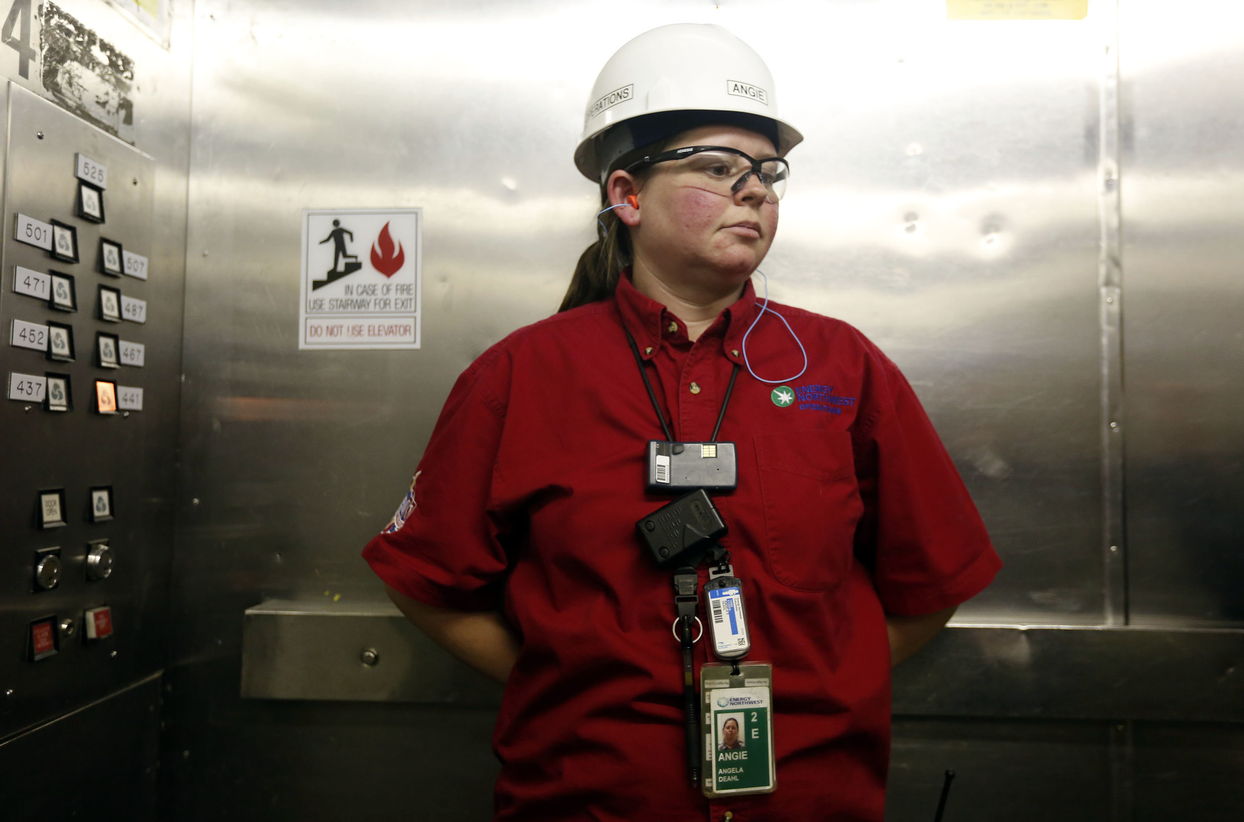   Angela Deahl, an equipment operator, pauses in the quiet of the elevator near the end of her overnight shift at the Columbia Generating Station near Richland.     