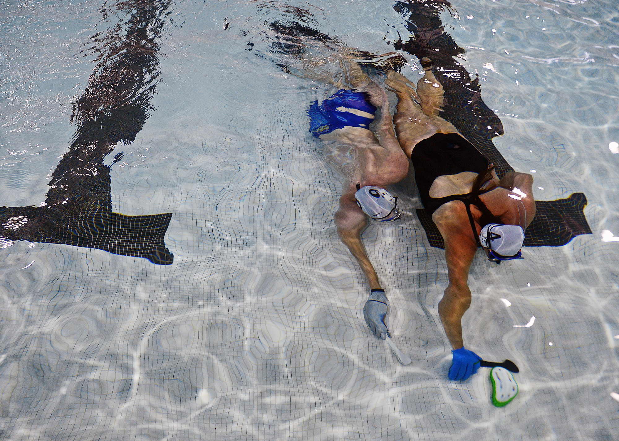  Guillaume Delaviel-Anger, left, and Tracy LaPietra move underwater towards the goal during a pickup game with Southeast Connecticut Underwater Hockey on Sunday, August 19, 2018 at UConn Avery Point.  