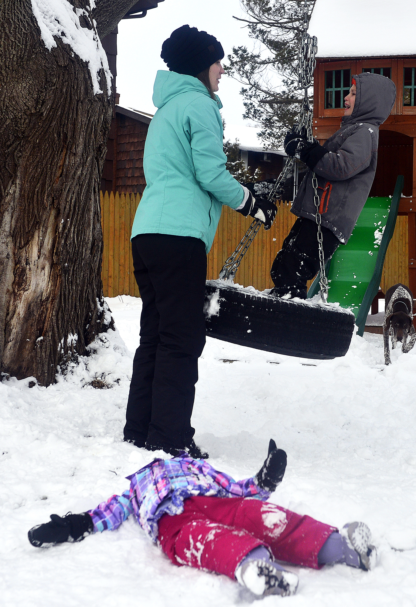  Kelsey talks to her Colton as he cries while Hadley lies on the ground as the family spends time on a snow day playing outside on Tuesday, Jan. 30 at their home in Groton. When Colton acts out, Kelsey's instinct is to punish him, but she now pauses 