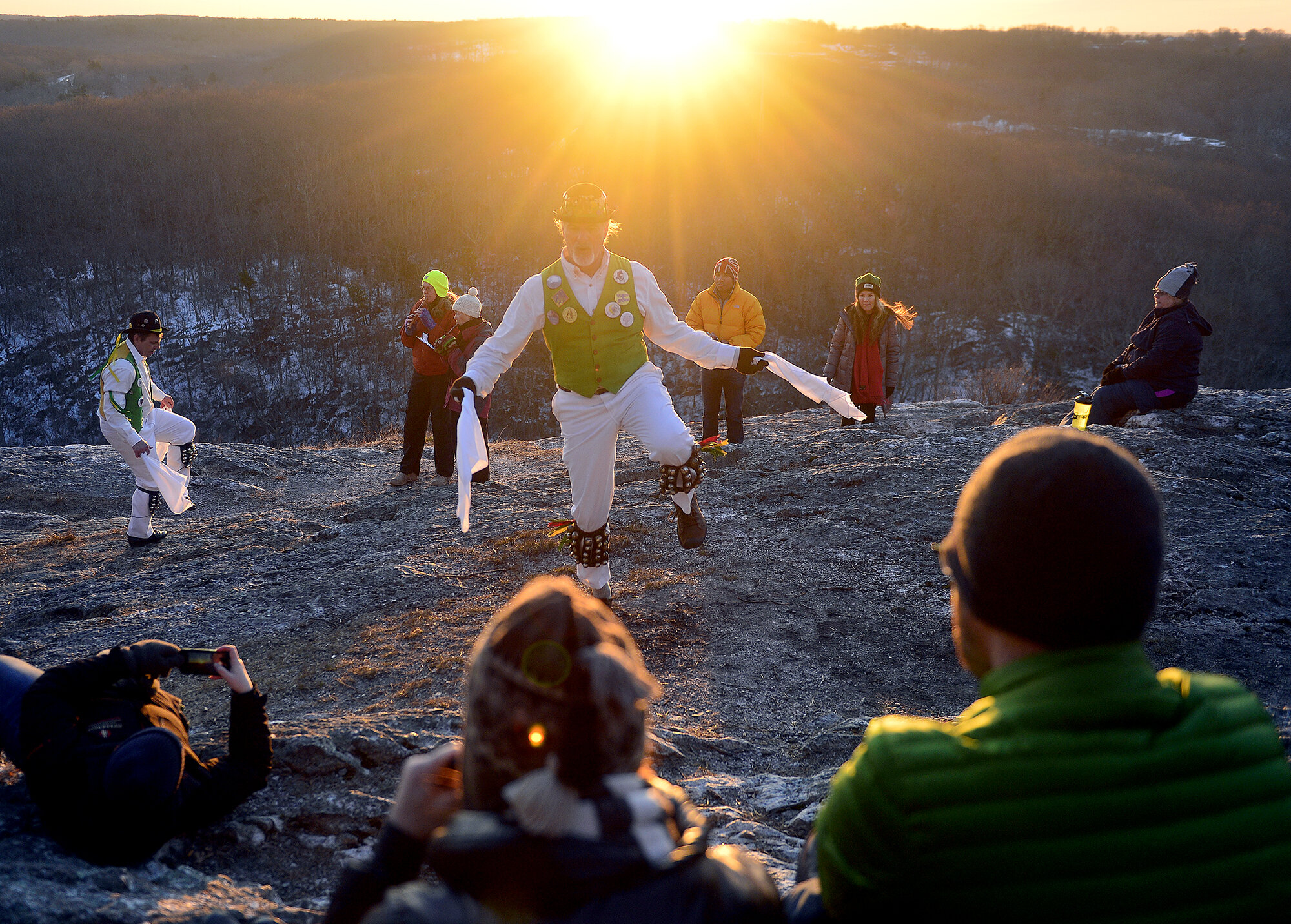 Spectators watch as the Westerly Morris Men mark the sunrise of the first day of spring on Tuesday, March 20, 2018, on top of Lantern Hill in North Stonington. The a traditional English ritual dancing group was founded over 40 years ago and has been