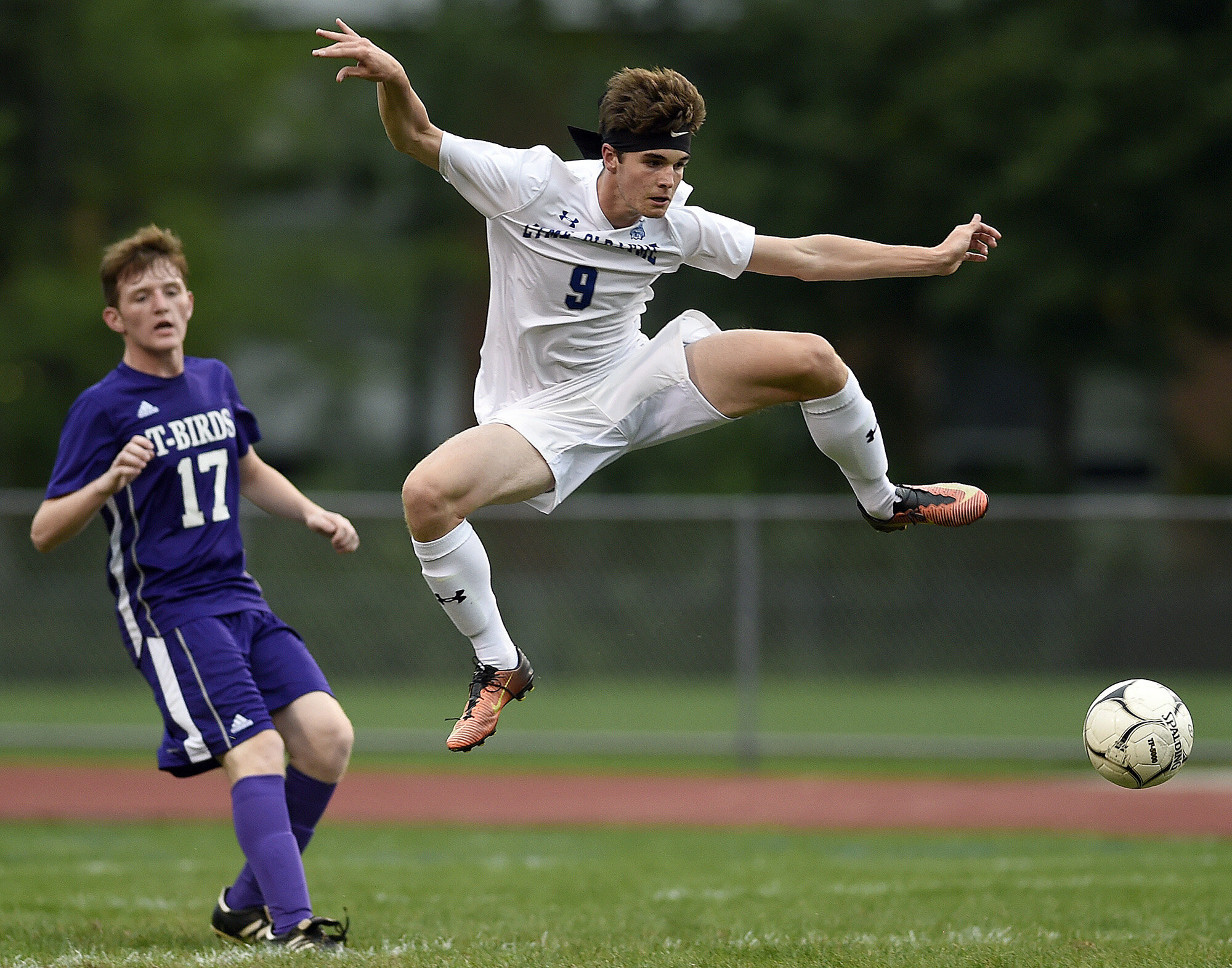  Old Lyme's Rory Cavicke (9) kicks a ball past North Branford's Jason Stanford (17) during a boys soccer game on Thursday, September 12, 2019 at Colafati Field. (The Day)  