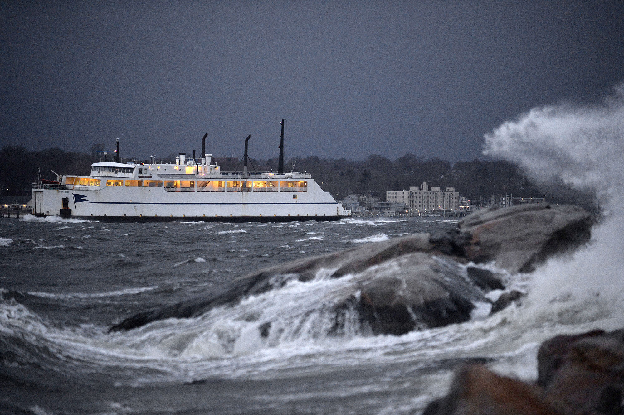  The Cross Sound Ferry Susan Anne moves thorough rough waters as waves crash on the rocks at Eastern Point Beach on Wednesday, January 30, 2019 in Groton. (The Day)  