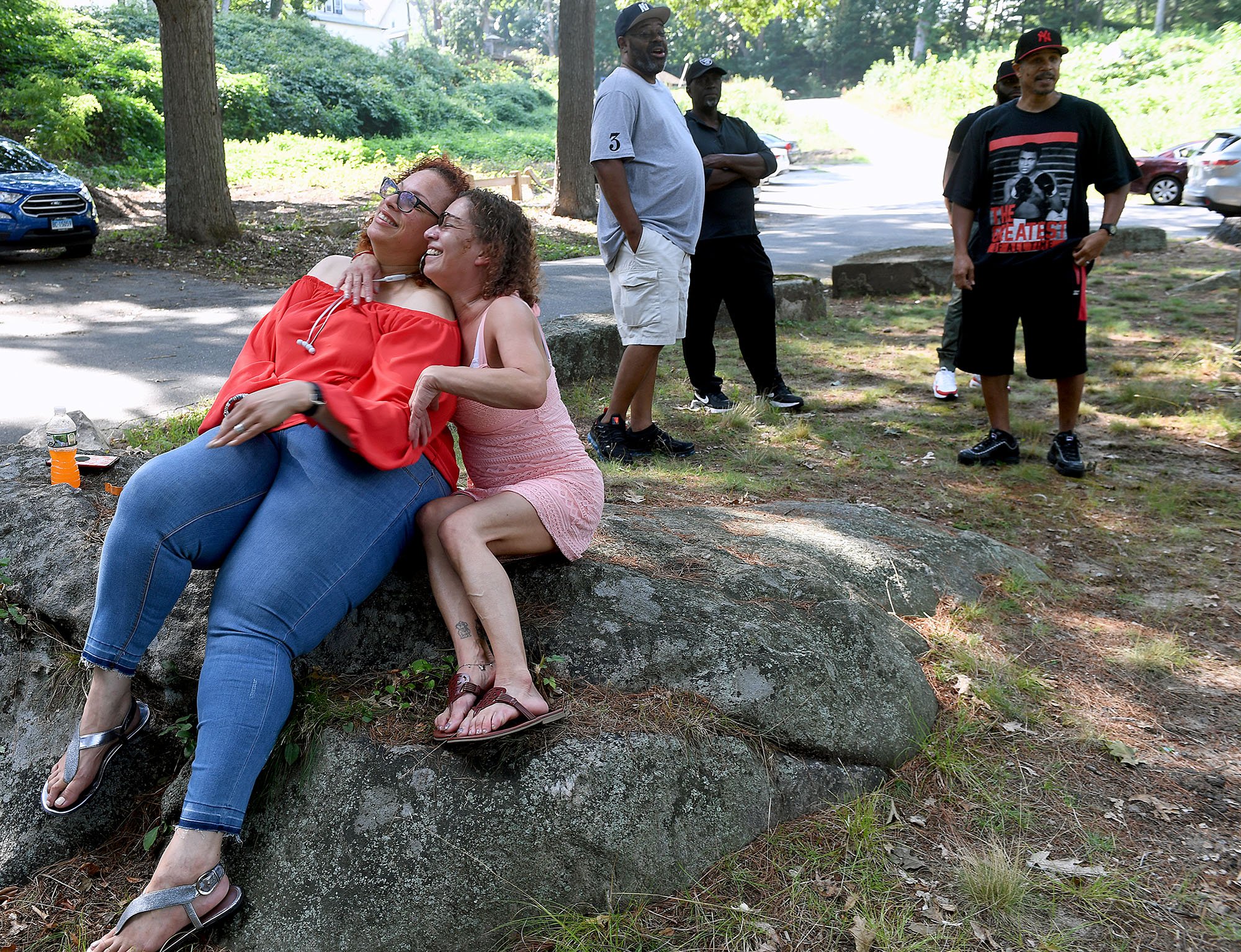  Friends Linda I David-Paul, left, and Cathy Hudak hug as they talk during a reunion for formal Thames River Apartments residents at Riverside Park in New London on Saturday, August 27, 2022. The two women grew up in the towers on Crystal Ave tougher