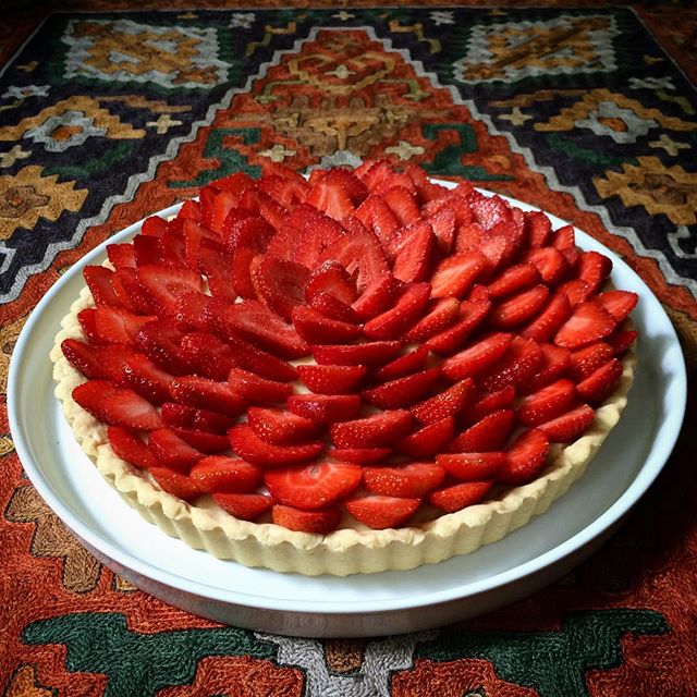 Fresh, local strawberries go well with a sugar pie crust, kirsch pastry cream and a sprinkling of powdered praline.