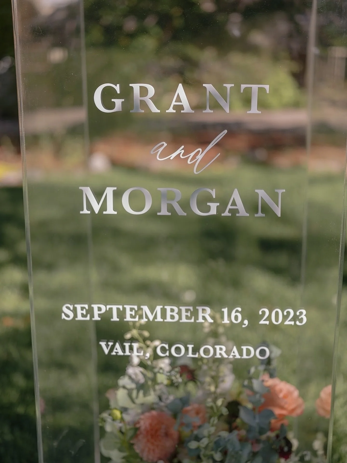 Still obsessed with this sign that was a flower filled acrylic pillar at Morgan and Grant&rsquo;s ceremony site 😍