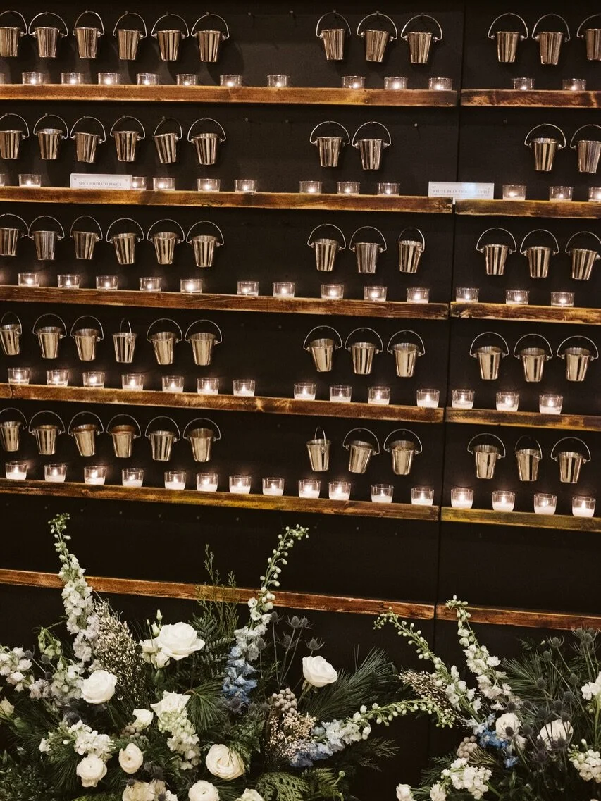 This cold weather has got me thinking about our last winter weddings famous Wall of Flame by @cateringbydesignco 🥣 
The Wall of Flame has little cups of soup heated by small tea lights for guests to grab for themselves during cocktail hour. So fun, 