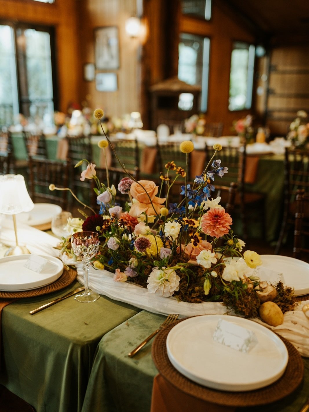 This design was such a fun one to make come to life! The couple wanted natural colors that were native to Colorado, rattan elements and a boho vibe. They wanted all the floral to feel like walking through a field of rainbow wild flowers with touches 