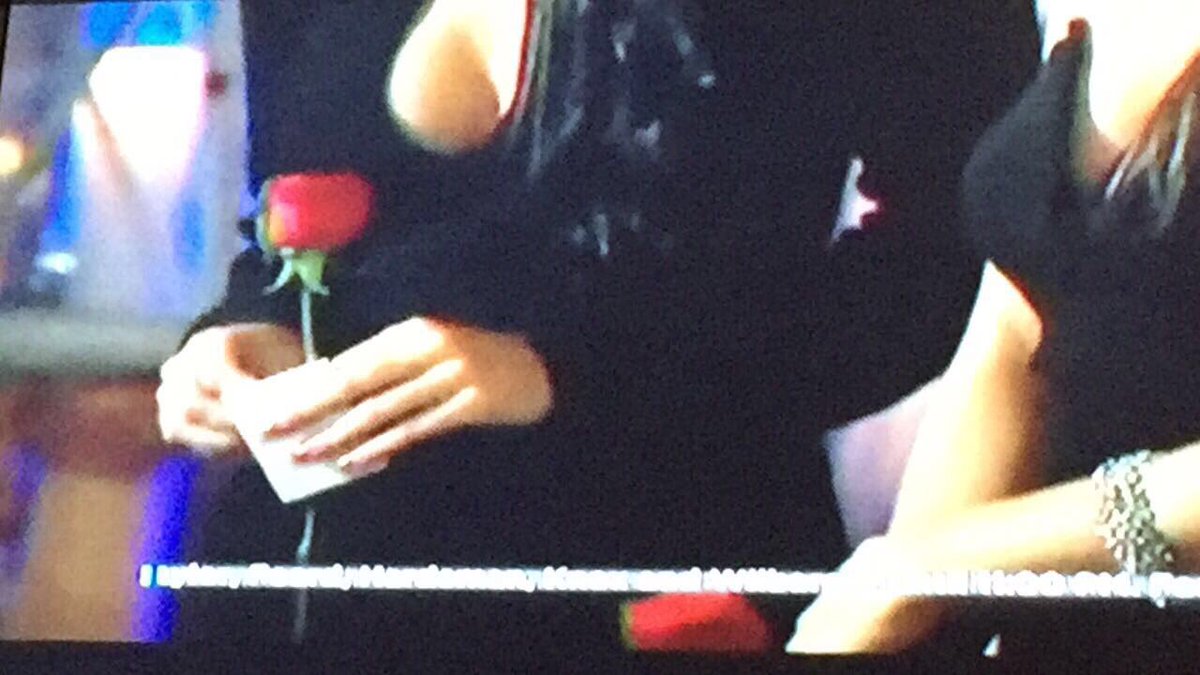 See that note in her hand? 