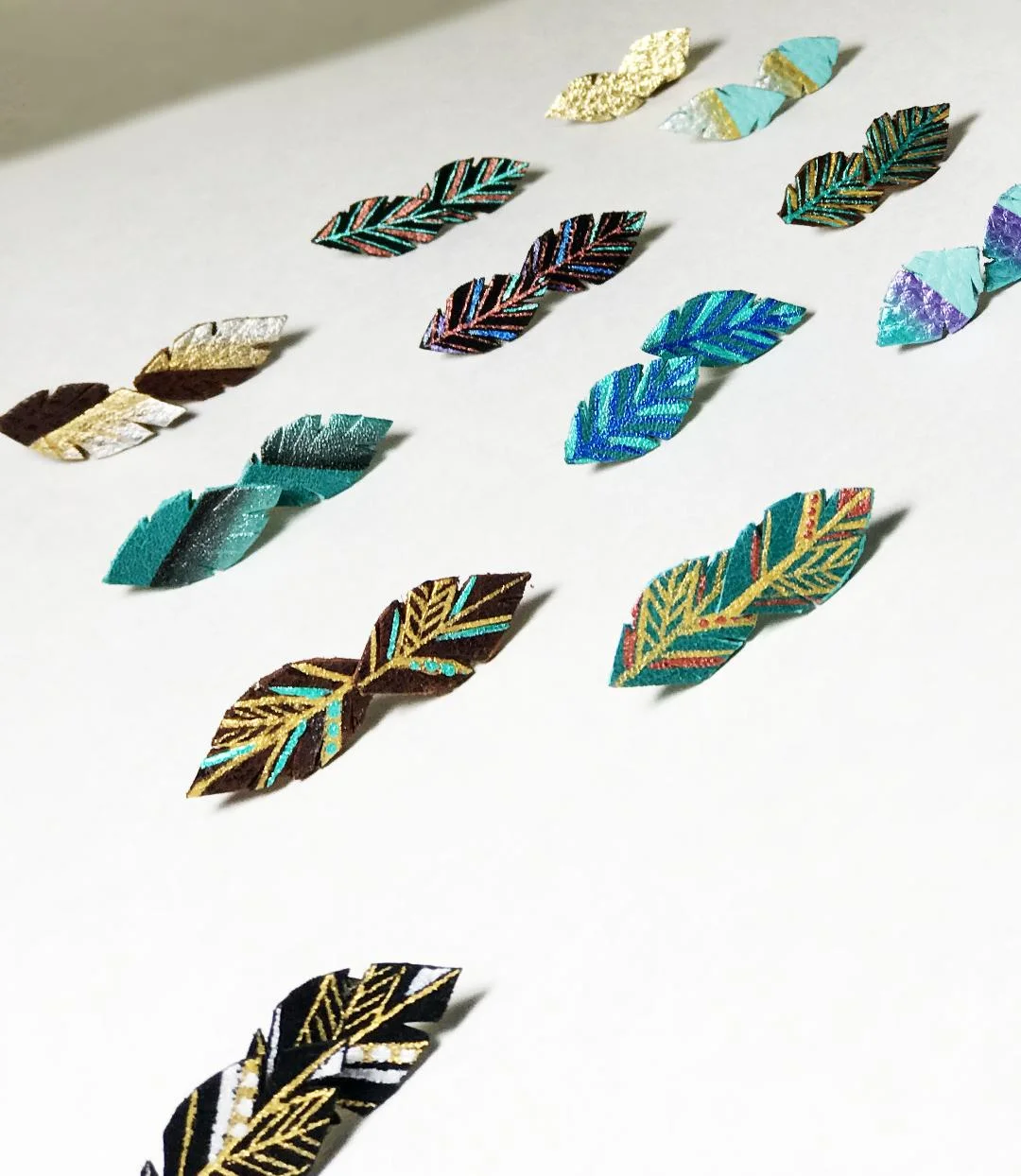 BellaDrops leather feather studs earrings