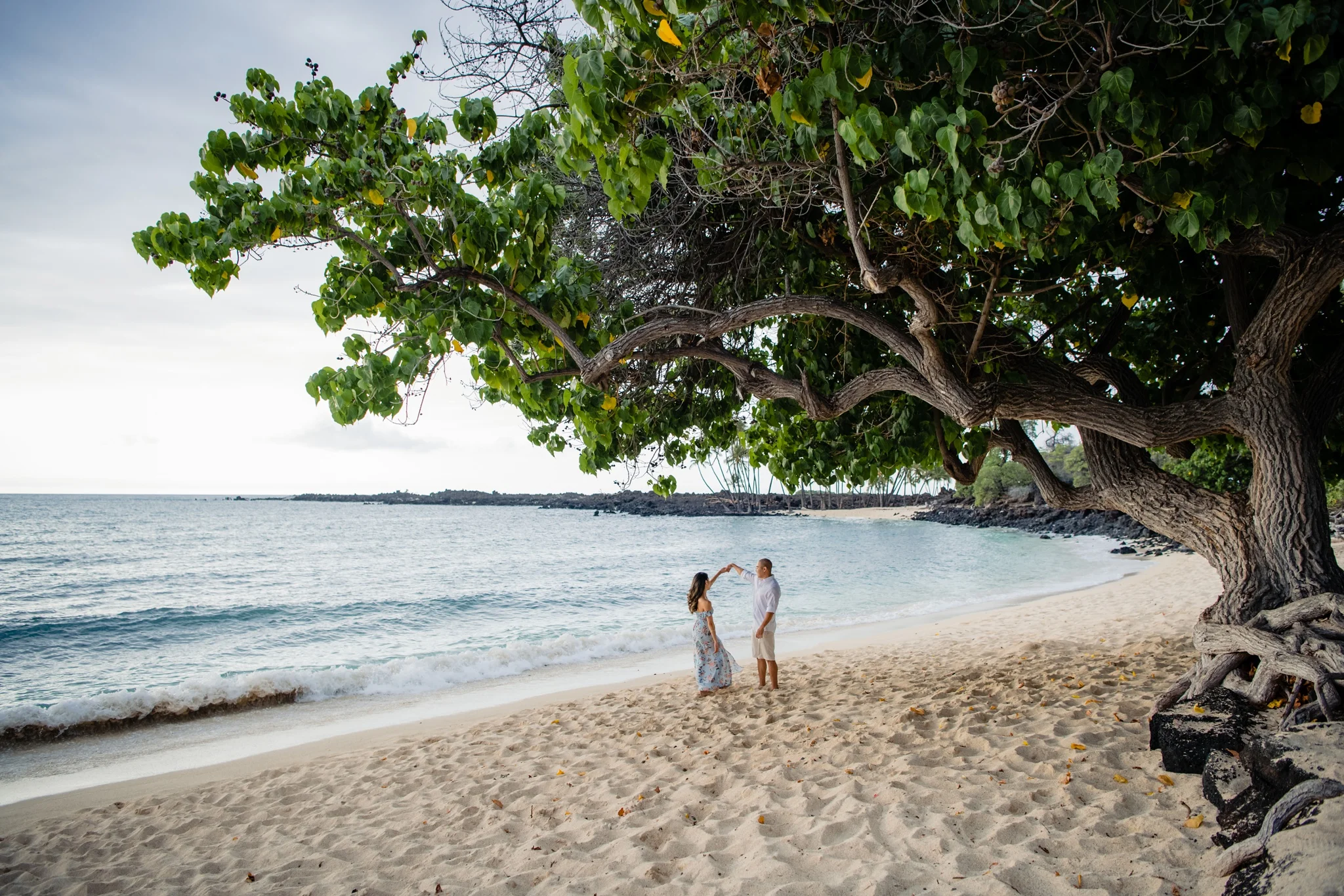 newly engaged couple at kona beach