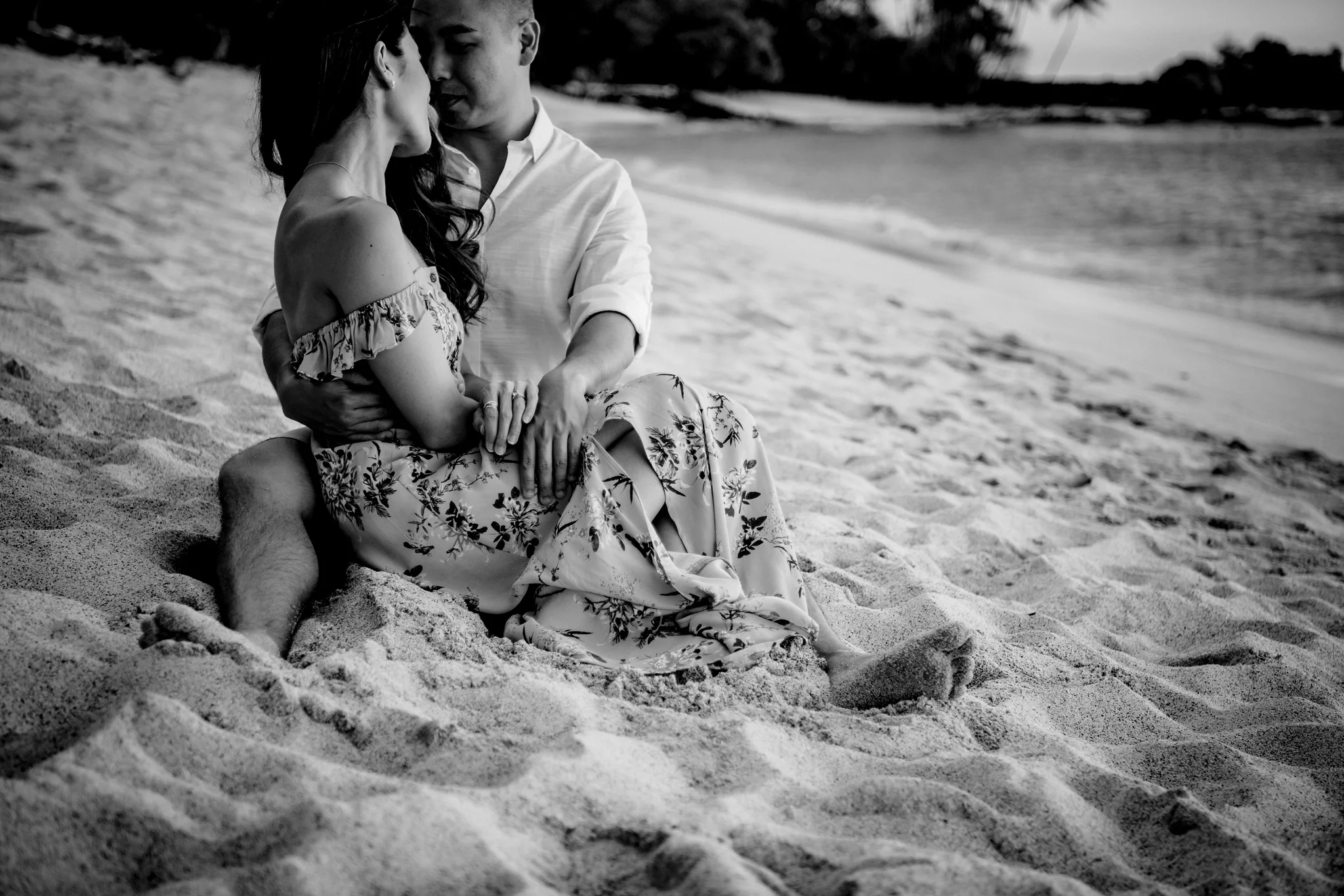 intimate embrace between engaged couple