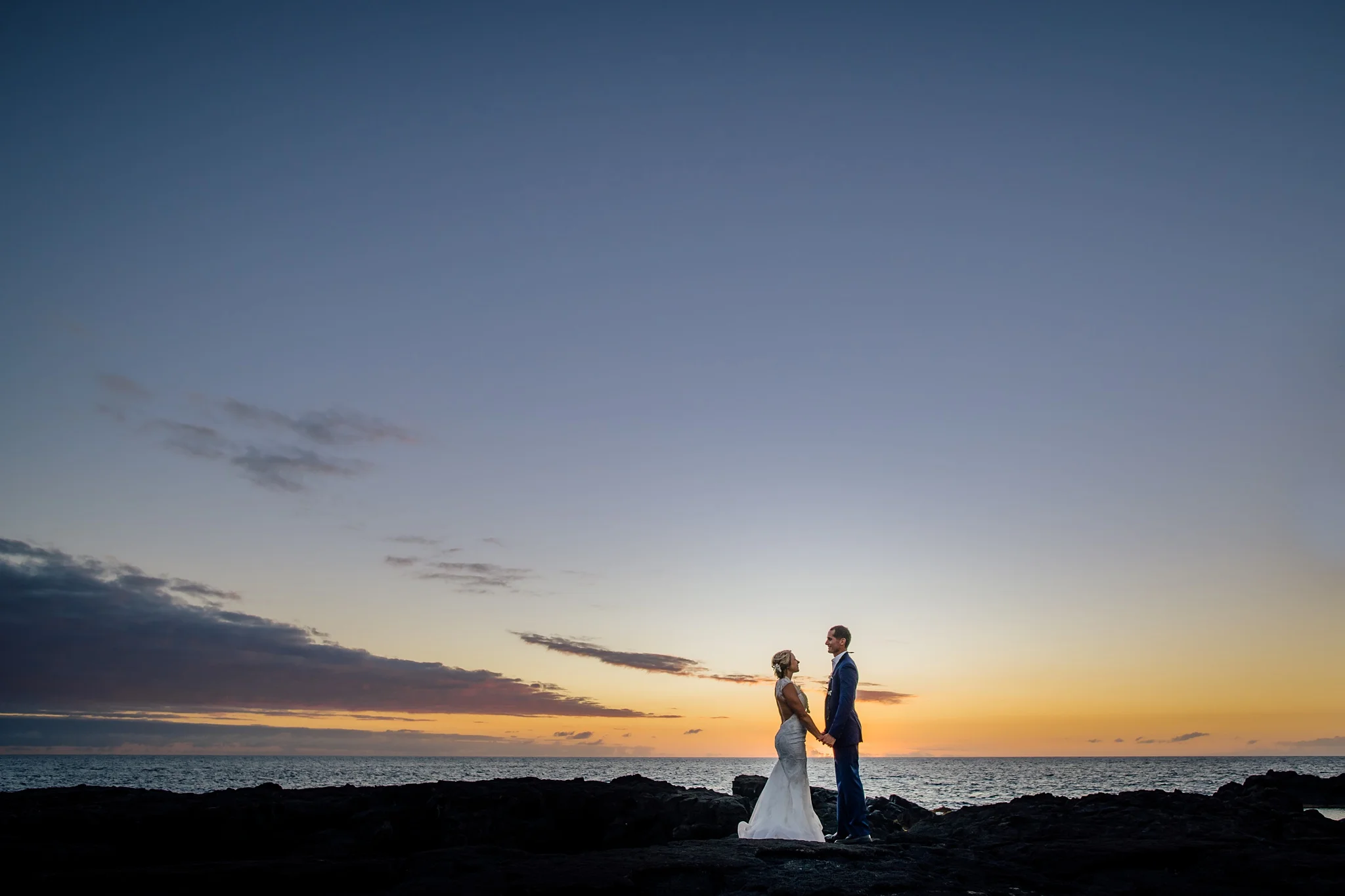 bride and groom in sunset