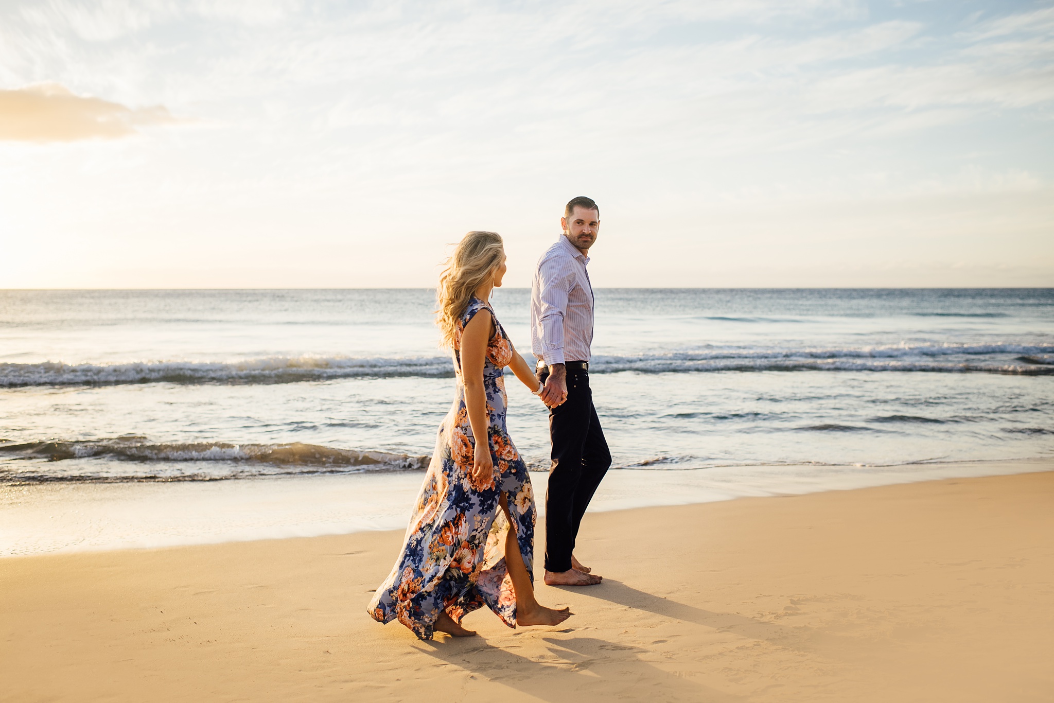 couple walking on the beach on the big island