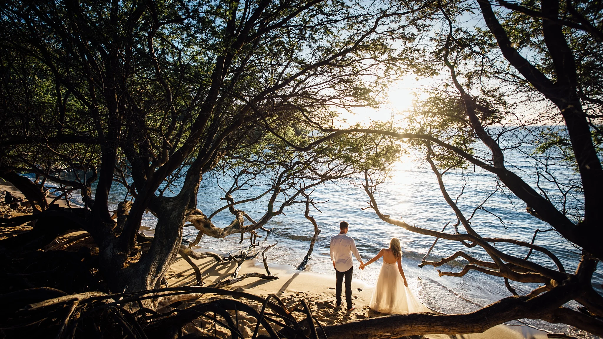 couple on their wedding day at waialea bay