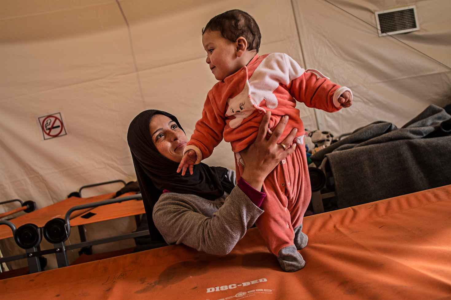 A mother with her child, at the camp on the edge of the Macedonia border. Many gets stuck there either for medical issues or lack of papers. Always in the hope to cross over as soon as possible.