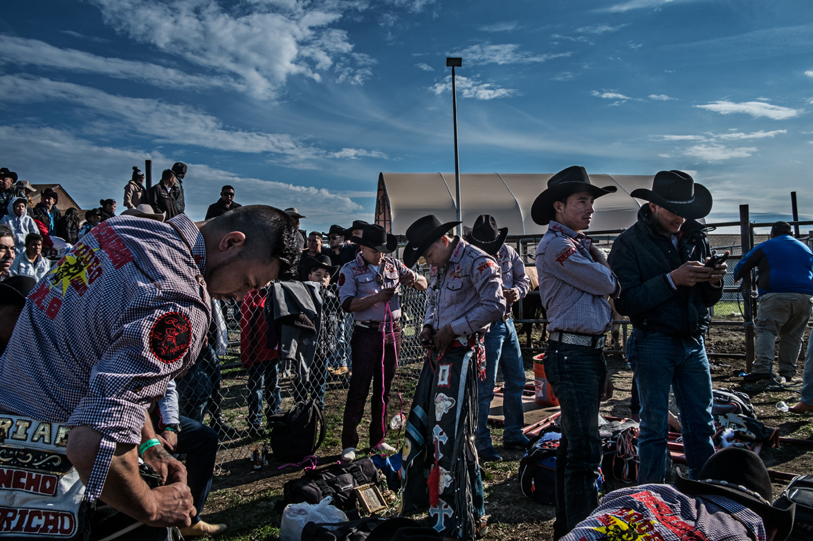 Bull riders preparing their outfit. Their outfit is very important for the riders as it represents their Latino culture.