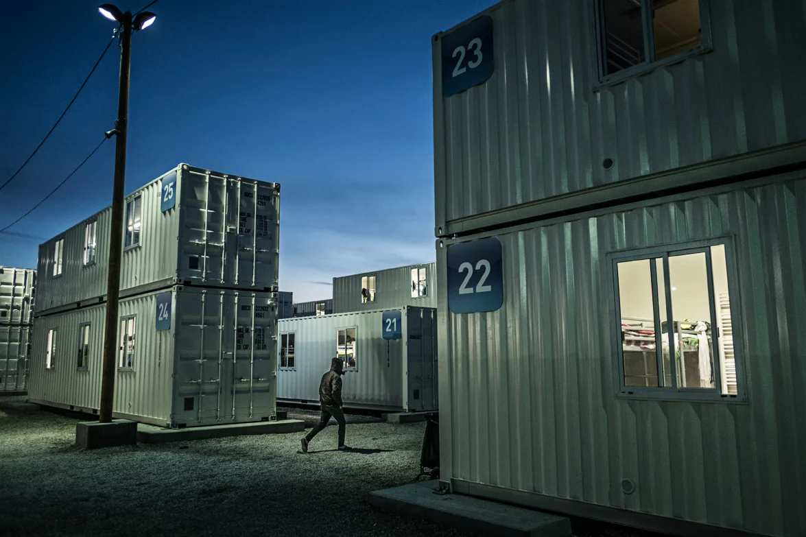 The night falling. Many will stay warm but the containers are only a temporary solution to a bigger issue. With the English borders still refusing to take in any migrants, the population of the Calais jungle is still growing where many still hope to reach England.