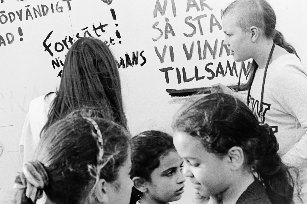 Children's writing on a wall near the three tents., "You are strong, we will win this together".