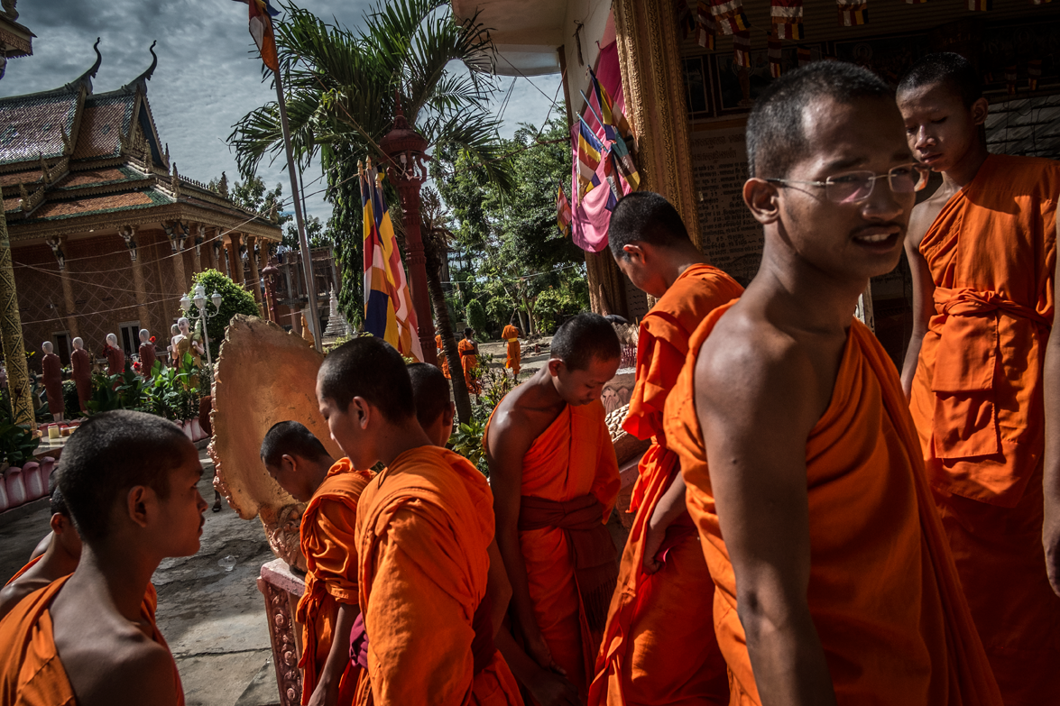 A Buddhist orphanage. Due to a high percentage of orphans in Cambodia, a Buddhist temple takes in many children from the streets and offers education through the teaching of Buddhism. Many end up staying through adulthood. Approximately 97% of Cambodia's population follows Theravada Buddhism with Islam, Christianity, and tribal animism making up the bulk of the remainder. Siem-Reap, Cambodia / All rights reserved © Clément Martz.