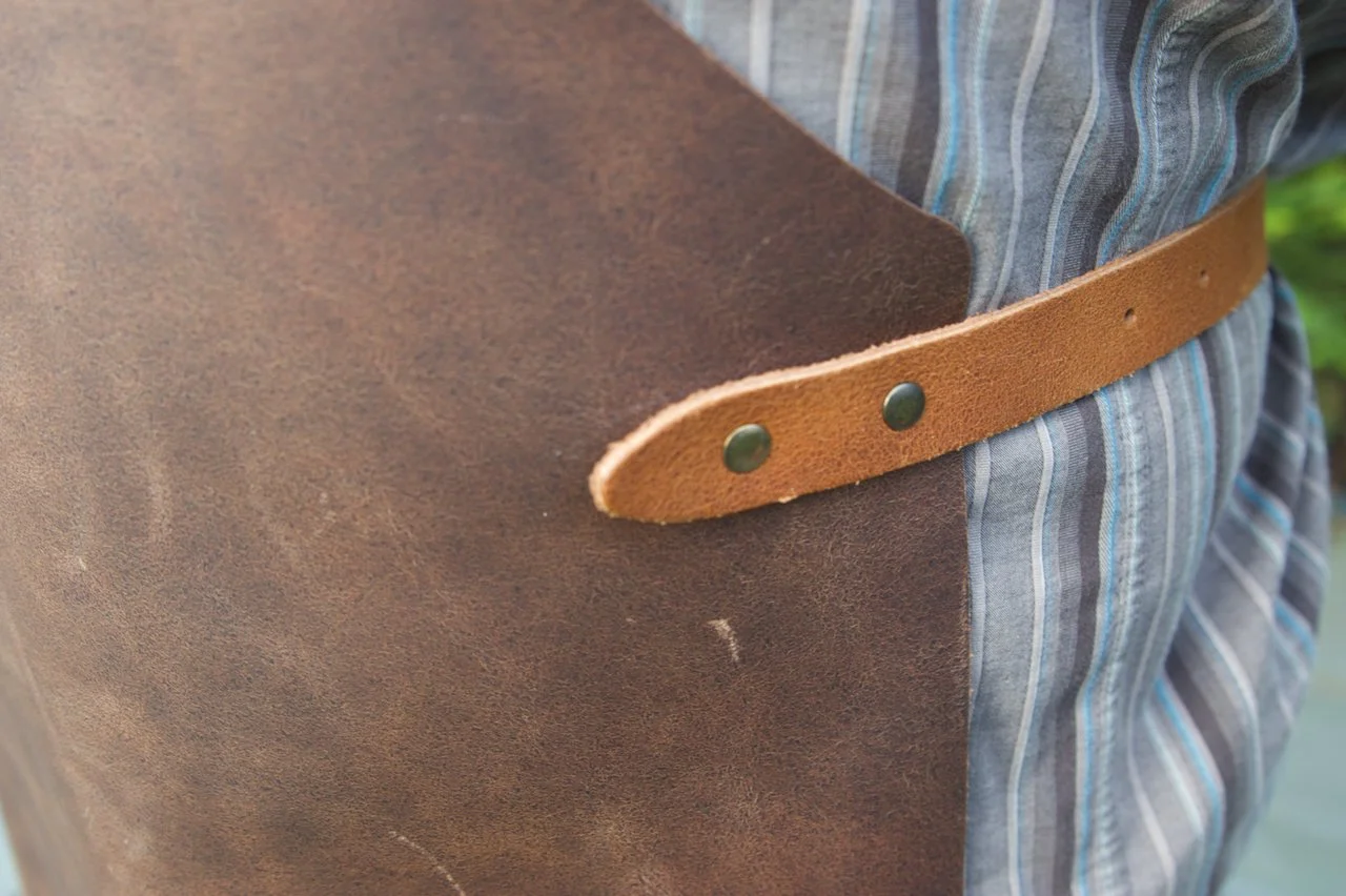 Side strap detail of a Stalwart Craft Classic Leather Apron